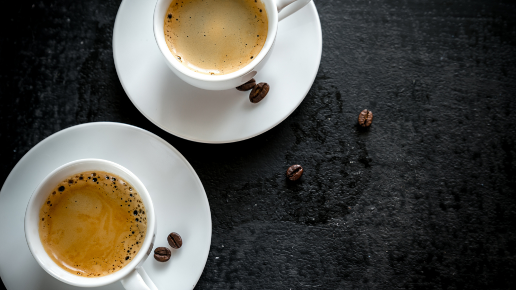 Espresso with crema and coffee beans