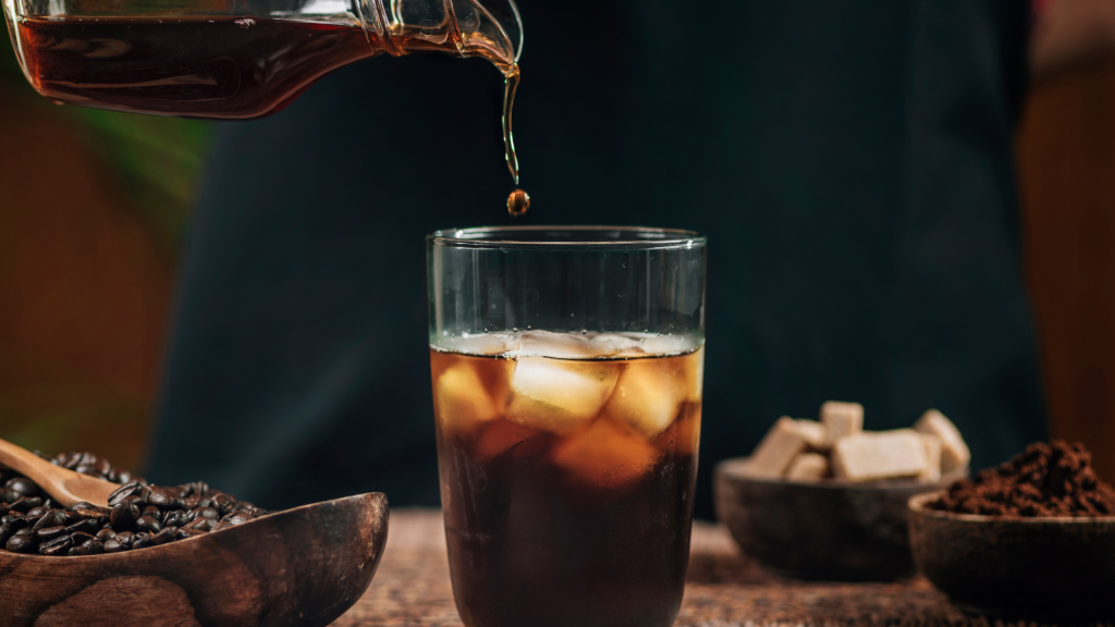 Pouring cold brew over ice
